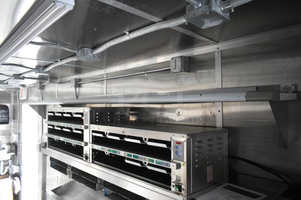 Brand new 2021 mobile food trailer with CaptiveAire grease hood, 3 True freezers, cooler, H&K fry freezers, sinks.