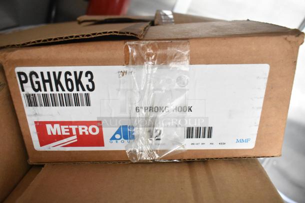 Cardboard box labeled "Metro PGHK6K3" containing a 6" prong hook, sealed with clear tape.