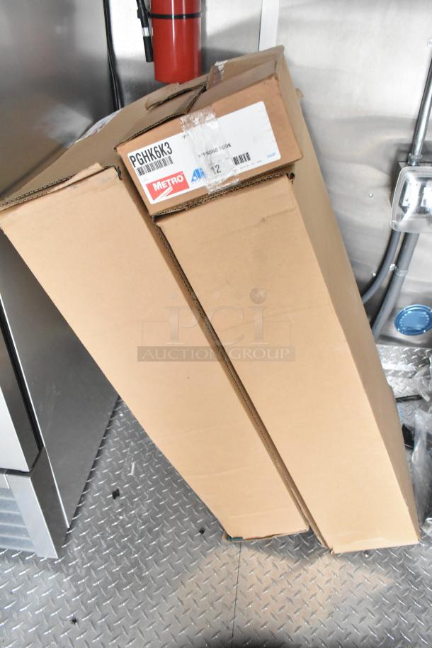 Boxed Metro PGHX6K3 C-prong hook, part of new 2021 food trailer setup. Features fire extinguisher and metal floor.