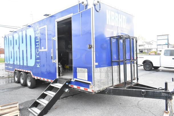 Brand new 2021 food trailer, blue with "NBRHD Kitchens" signage, equipped for various kitchen concepts.