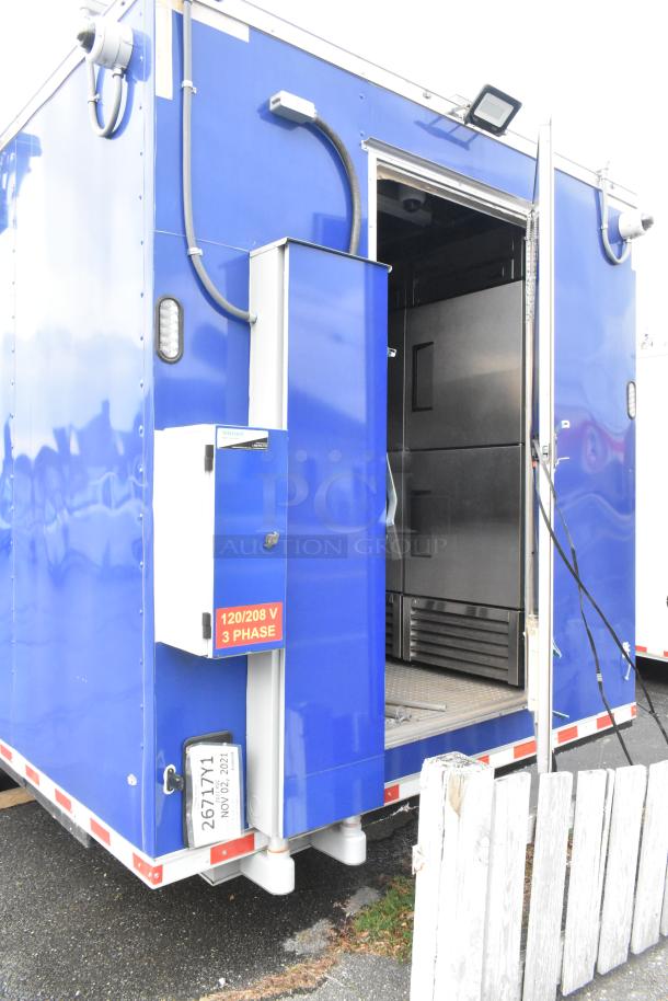 Brand new 2021 blue food trailer with CaptiveAire hood, True freezers, cooler, fryers; perfect for ghost kitchen startup.