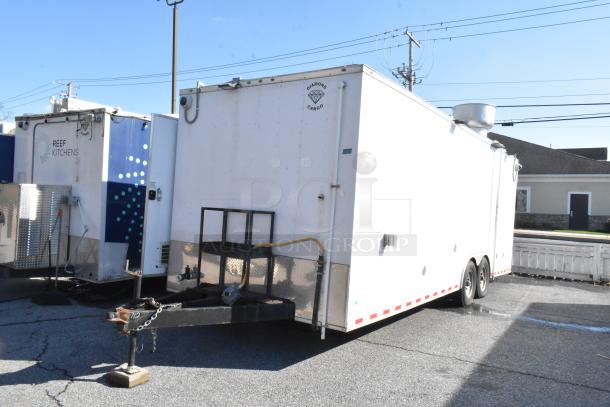 Brand new 2021 mobile kitchen trailer with commercial-grade equipment, grease hood, True freezers, and cooler.