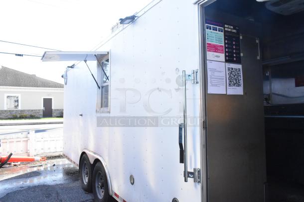 Brand new 2021 food trailer with open side service window, exterior door, and visible interior setup.
