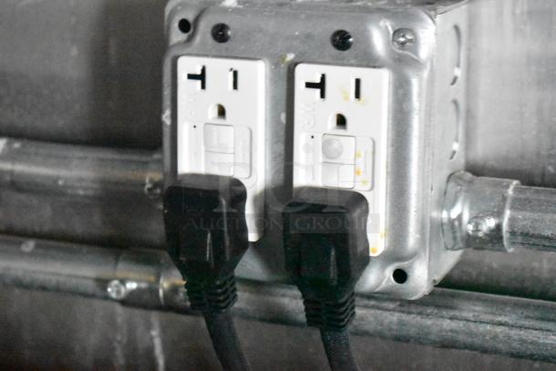 Electrical outlet with two plugs in a fully outfitted 2021 food trailer. Durable, commercial-grade setup.