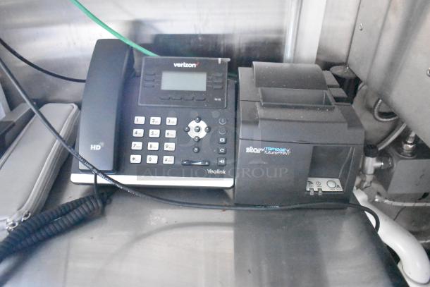 Yealink phone and Star TSP100 futurePRNT printer on a countertop in a food trailer.