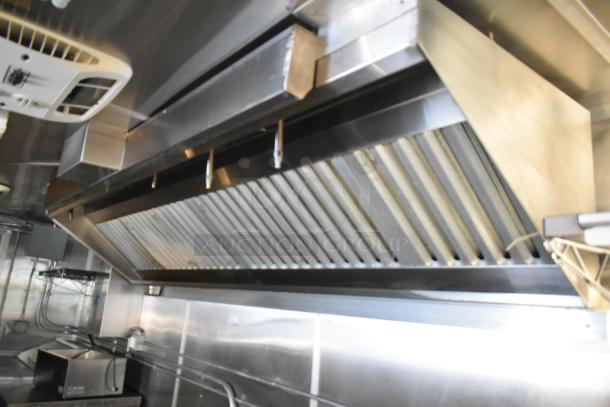 Brand new CaptiveAire grease hood in a fully equipped 2021 food trailer. Stainless steel, commercial-grade kitchen setup.