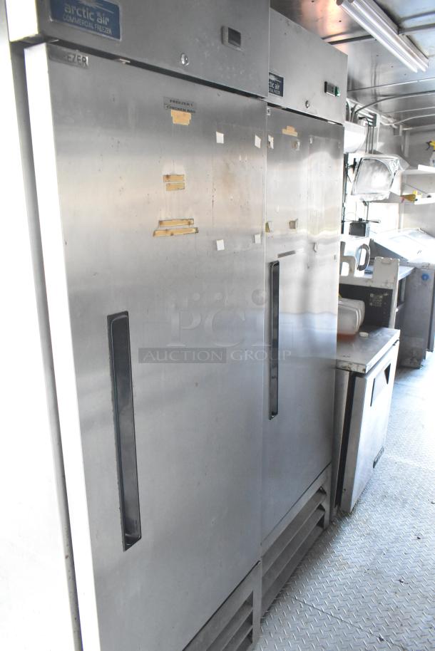 Arctic Air commercial freezers in a food trailer, featuring stainless steel design and labeled "Freezer 1 Chicken Bao."
