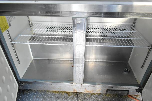 Commercial-grade Arctic Air cooler interior with dual wire shelves, stainless steel finish, and diamond plate flooring.