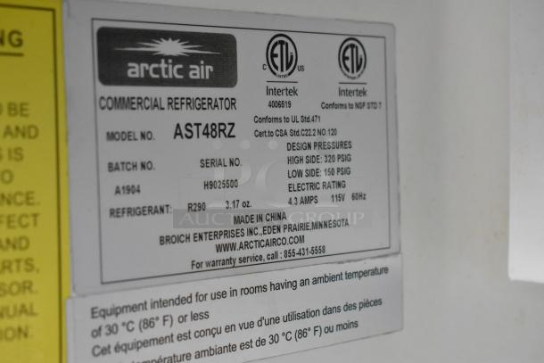 Arctic Air commercial refrigerator label, model AST48RZ. Includes serial no. H9025500, electric rating 115V, 60Hz, and contact info.