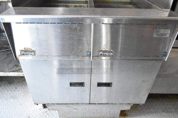 Pitco Frialator gas fryer in stainless steel, commercial-grade, showing signs of use. Includes NSF label, setup for a food trailer.
