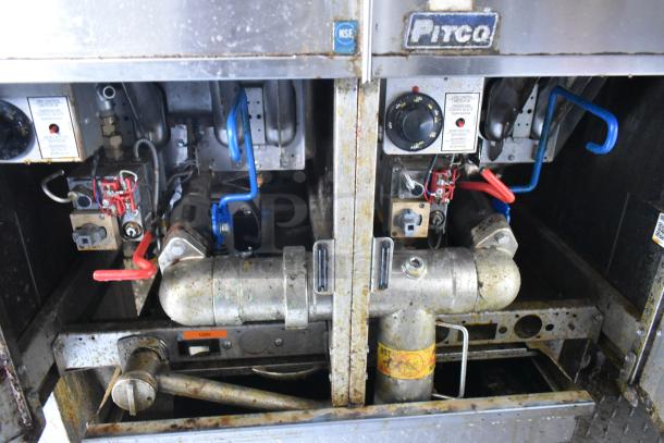 Pitco Frialator gas fryer interior with visible controls and piping in a new food trailer. Prominent NSF sticker.