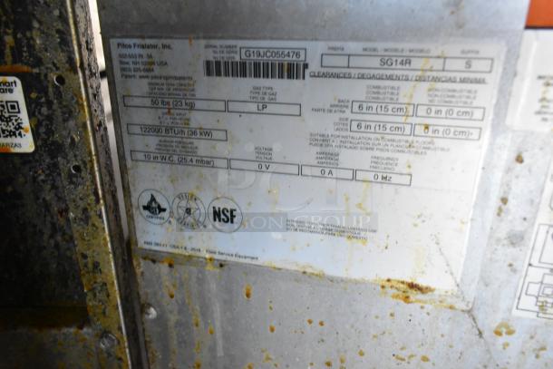 Close-up of Pitco Frialator serial plate, model SG14R, displaying technical specs including 122000 BTU/h and NSF certification.