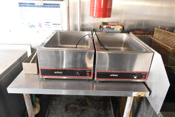 Food trailer interior showing twin Winco food warmers, stainless steel build, commercial-grade equipment, lightly used.