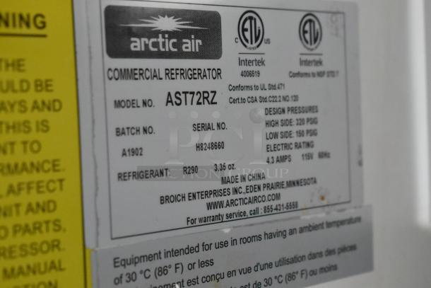 Label on Arctic Air commercial refrigerator, model AST72RZ, featuring specifications and contact info for warranty service.