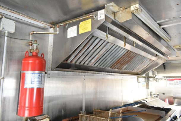 Brand new food trailer interior with Pyrochem grease hood, fire suppression system, and Pitco Frialator gas fryer.
