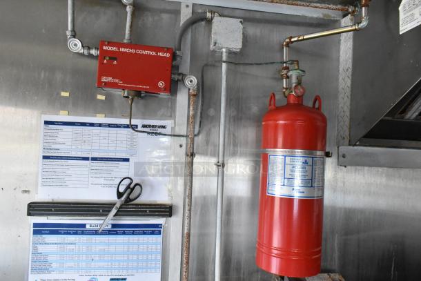 Food trailer interior showing Pyrochem fire suppression system and control head, Arctic Air appliance list, and maintenance notes.