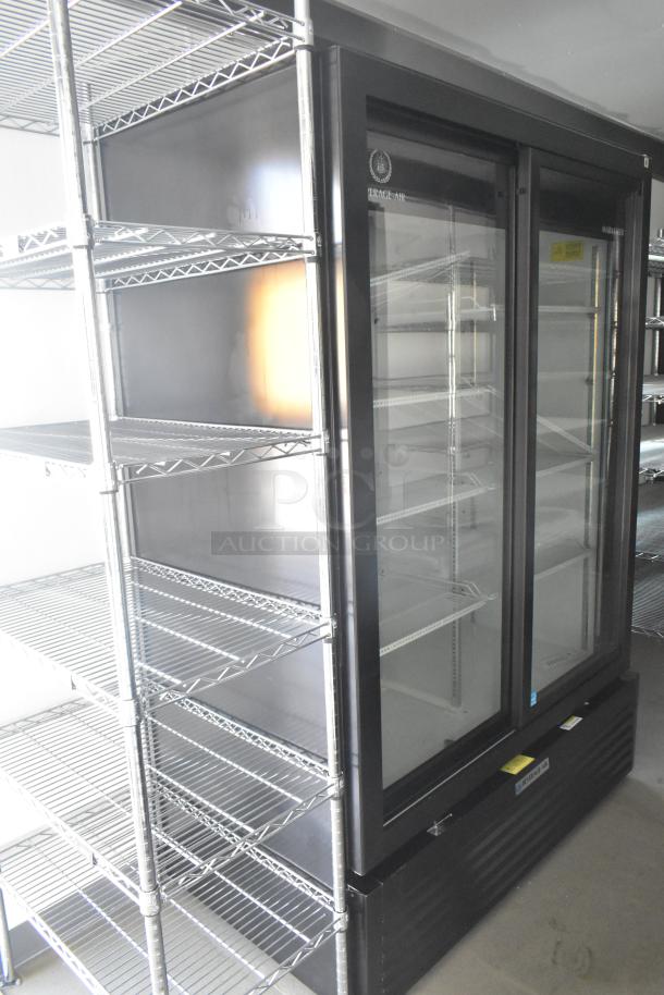 Commercial refrigerator and stainless steel shelving inside a new food trailer. Ideal for catering and ghost kitchens.