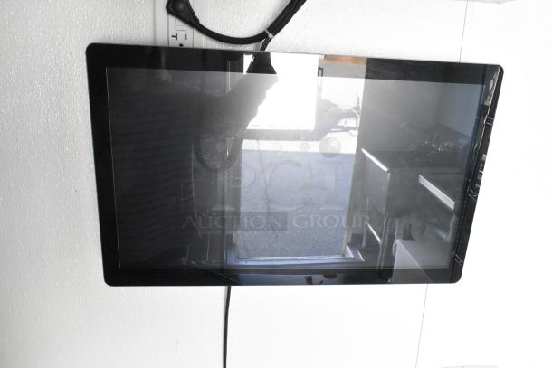 Fully equipped unbranded food trailer interior, featuring a commercial-grade setup with cooler, freezer, and shelving.