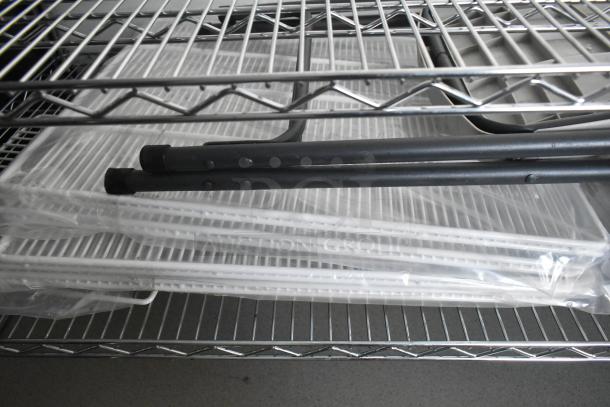 Stainless steel wire shelving unit in a food trailer, showcasing storage capability for equipment.