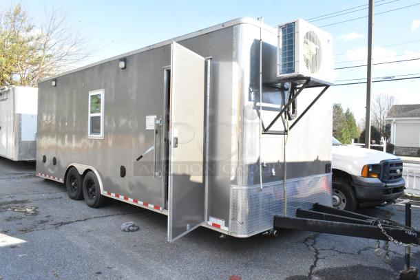 Brand new fully outfitted unbranded food trailer with commercial equipment, including Beverage Air coolers, Waring panini press, and Gree air curtain.