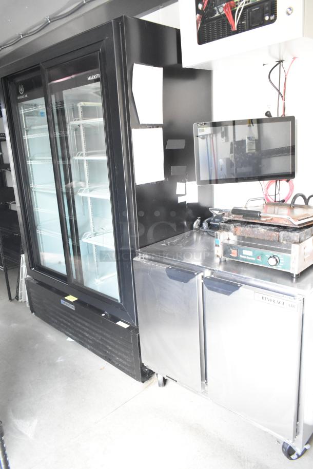 Fully equipped mobile kitchen food trailer with Beverage Air coolers, Waring panini press, and POS system, ideal for ghost kitchen.