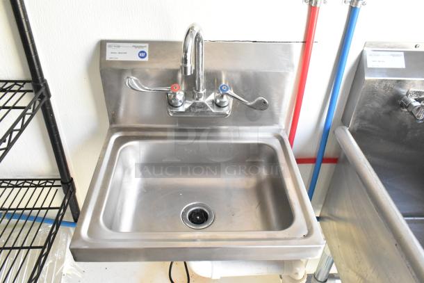 Stainless steel commercial sink with dual temperature taps, NSF labeled. Mint condition, ideal for food trailer use.