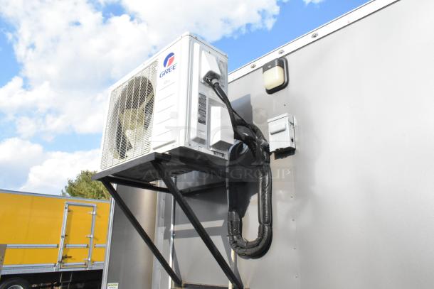 Food trailer with Gree air curtain unit. Ideal for mobile kitchen setup. Equipped for diverse culinary operations.