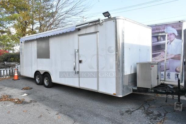 Unbranded food trailer with Coleman's Mack Ventilation System, shelves, wire shelving; ready for equipment installation.