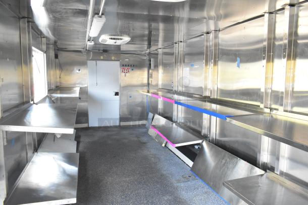 Brand new food trailer with Coleman's Mack Ventilation, wire shelving, ready for equipment. Stainless steel interior.