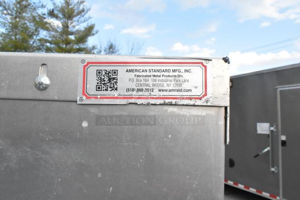 American Standard Mfg metal propane tank cage with visible label, showing contact info and web address; appears in good condition.