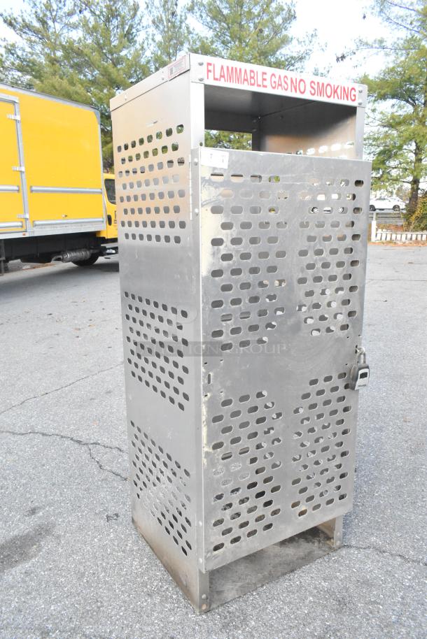 American Standard Mfg metal propane tank cage with perforated panels, lock, and "Flammable Gas No Smoking" sign.