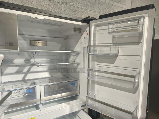 Frigidaire Gallery 21.5 cu ft 4-Door French Door Refrigerator, Model GRMC2273CF04, new condition, spacious interior, multiple shelves.