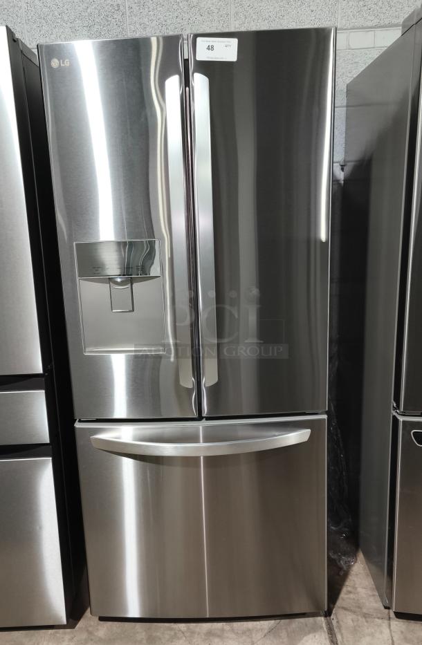 LG 21.8 cu ft French Door Refrigerator, Model LFDS22520S/06, like new, with external water dispenser, stainless steel finish.