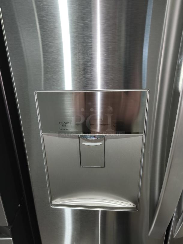 LG 21.8 cu ft French Door Refrigerator, model LFDS22520S/06, like new, with external water dispenser, stainless steel finish.