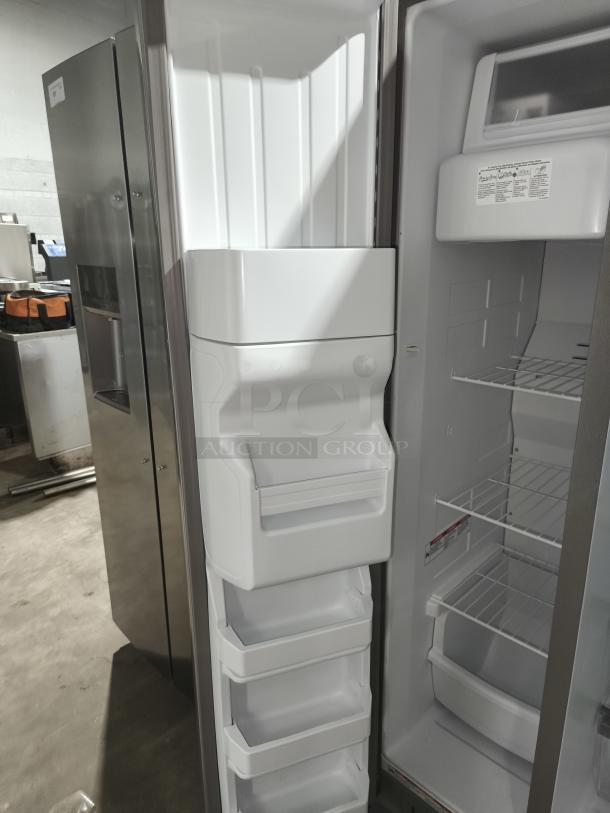 Whirlpool 36-inch side-by-side refrigerator, model WRS315SDHZ19, like new condition, spacious interior with shelves and bins.