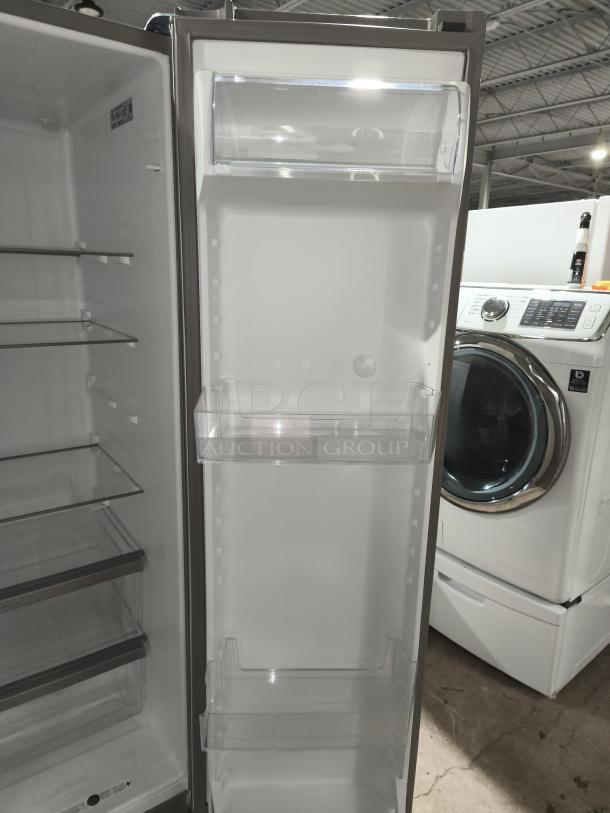 Whirlpool 36-inch side-by-side refrigerator, model WRS315SDHZ19, like-new condition, showing interior shelves and door bins.