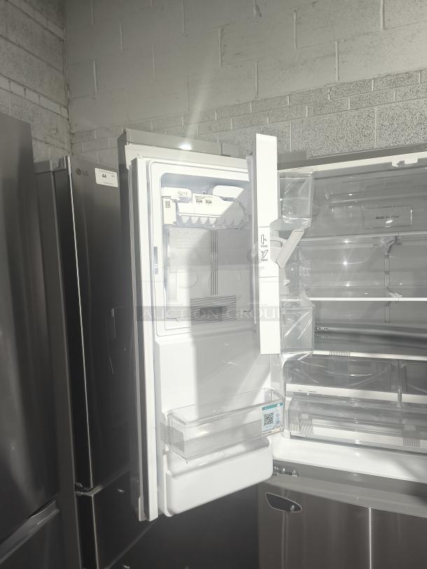 NEW LG LRFD28XBS Smart French Door Refrigerator, 27.7 cu ft, stainless steel, interior view with open drawers, label visible.