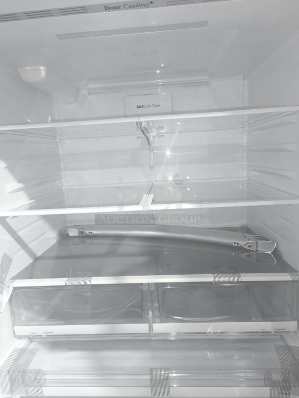 LG LRFD28XBS 27.7 cu ft Smart French Door Refrigerator interior view. Features Door Cooling and Multi Air Flow. New condition.