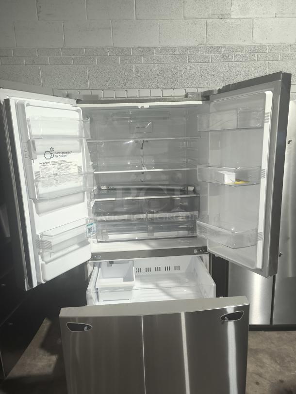 NEW LG LRFS28XBS 27.7 cu ft Smart French Door Refrigerator, stainless steel, open doors, spacious interior, model LRFD28XBS/05.