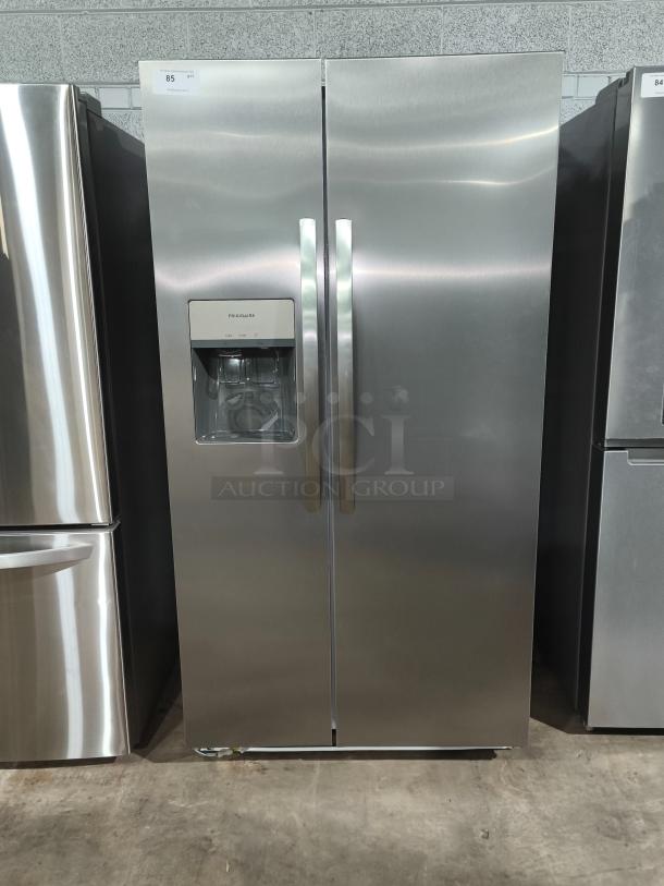 Frigidaire 25.6 cu ft side-by-side refrigerator, model FRSS26L3AFE, like new condition, stainless steel finish.