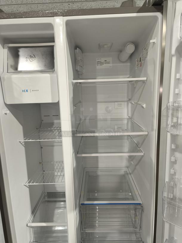 Frigidaire 25.6 cu ft side-by-side fridge, model FRSS26L3AFE, like new. Features ice maker, glass shelves, spacious interior.