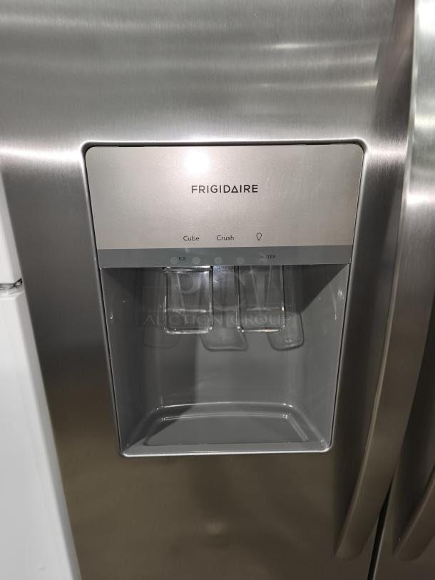 Frigidaire FRSS26L3AFE 25.6 cu ft side-by-side refrigerator, stainless steel, like new, with ice and water dispenser.