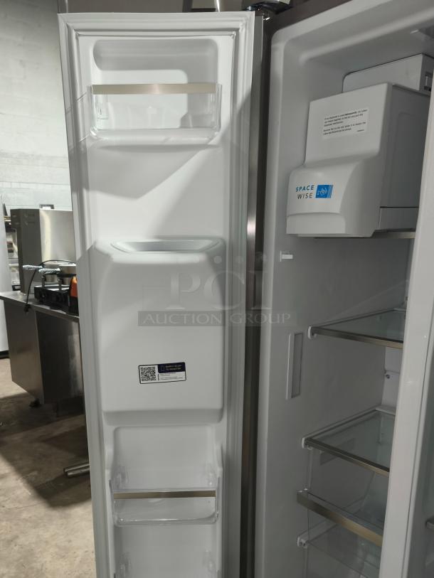 Frigidaire Gallery 25.6 cu ft Side-by-Side Refrigerator, model GRSS2652AFA, new condition, open doors showing shelving and SpaceWise feature.