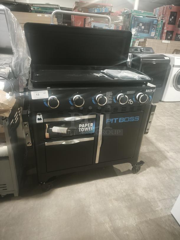 Brand new Pit Boss PB5BGD2 5 Burner Gas Griddle with Cabinet, black finish, lift-off top, paper towel dispenser, on wheels.