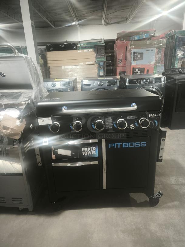 Brand new Pit Boss PB5BGD2 Ultimate 5 Burner Gas Griddle with cabinet, featuring backlit controls and paper towel holder.