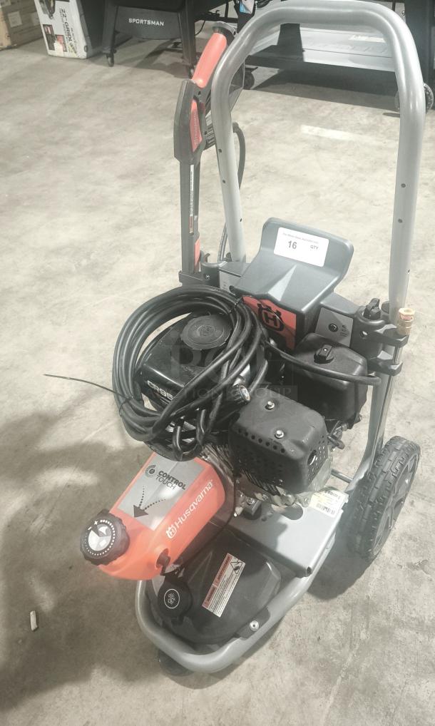 Husqvarna PW-3200 gas-powered pressure washer, model 022007, 3200 PSI, with hose and controls visible, in tested working condition.