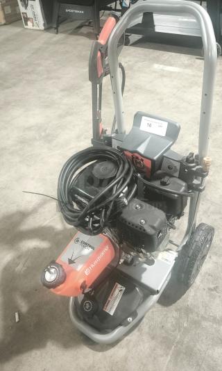Husqvarna PW-3200 gas-powered pressure washer, model 022007, 3200 PSI, with hose and controls visible, in tested working condition.