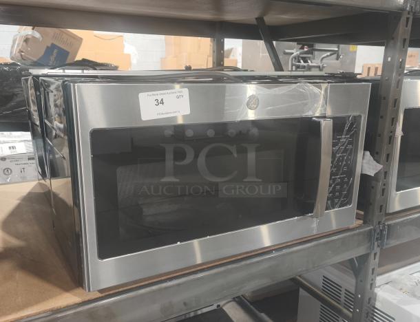 BRAND NEW GE 1.7 cu ft Over-the-Range Microwave, Model JVM6175SK6SS, with minor scratches and dents, in packaging.