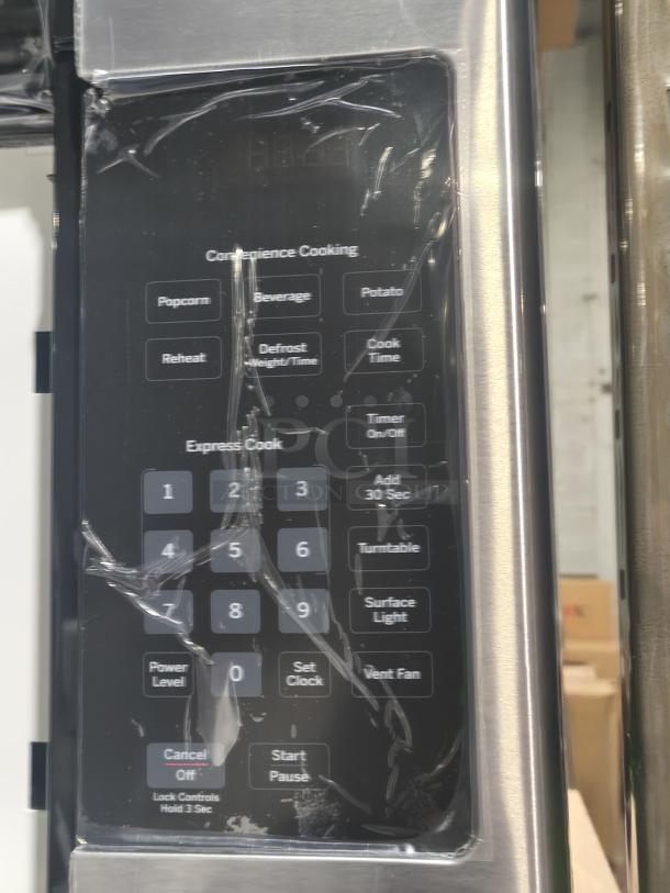 GE 1.6 cu ft Over-the-Range Microwave Oven, Model PVM9005SJ8SS, new with minor scratches, control panel visible.