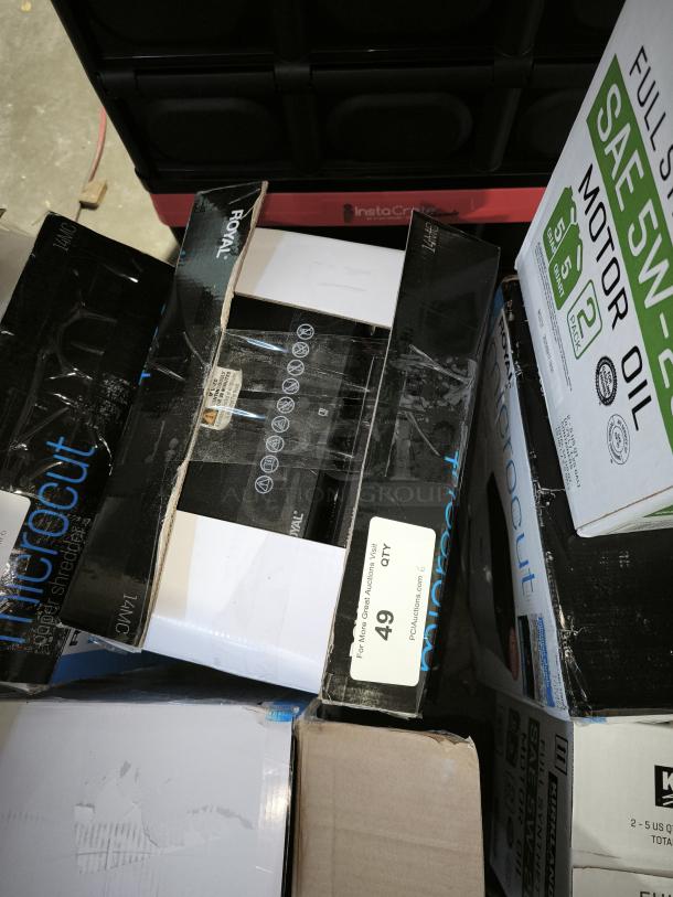 Brand new Royal MC14MX 14-sheet micro-cut shredder in box. Box shows "microcut" label and auction tag with lot number.